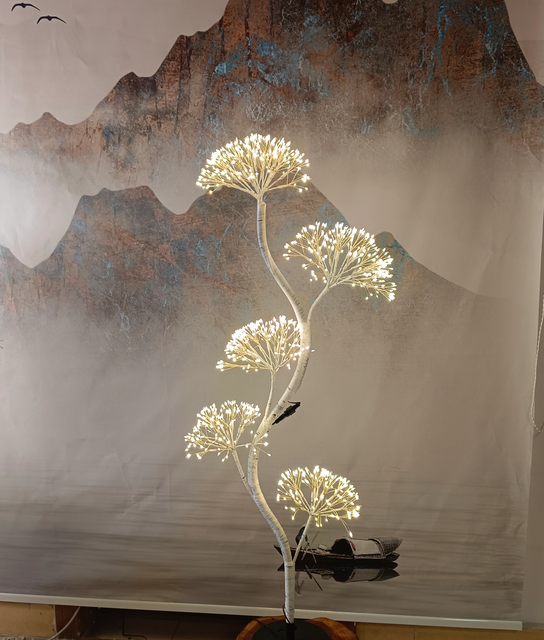 White firework tree light 120cm tall with segmented tree structure, emitting warm white light