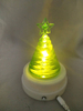 Green tree-shaped lamp with magnetic rotating base