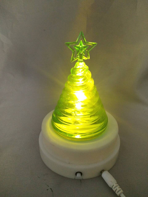 Green tree-shaped lamp with magnetic rotating base