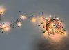 Cluster fairy light with green / white stone