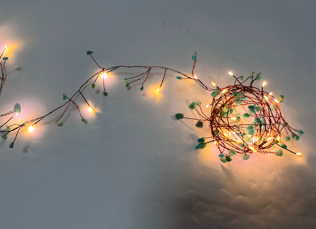 Cluster fairy light with green / white stone