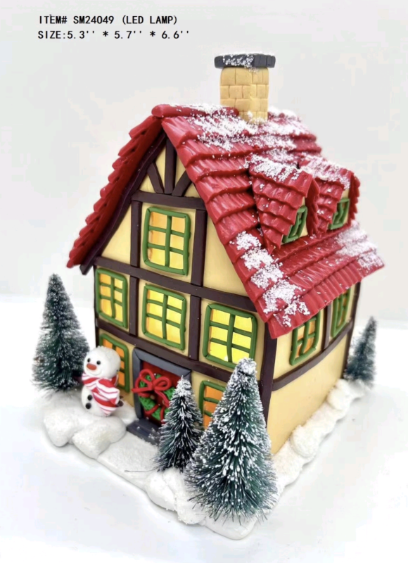 clay dough little snowman standing in front of the red house- 23