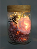 Glass pot with Xmas ornaments lights