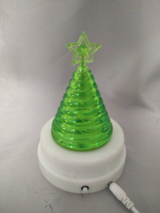 Green tree-shaped lamp with magnetic rotating base