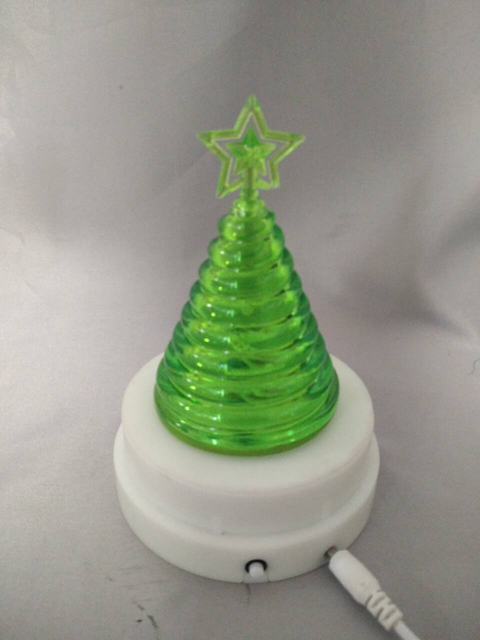 Green tree-shaped lamp with magnetic rotating base